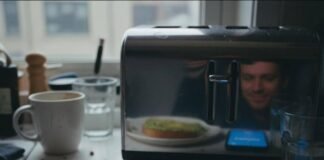 Intermittent Fasting: The Science Behind the Diet Trend Everyone’s Talking About Half-eaten avocado toast, phone with fasting timer, bleary reflection in toaster.