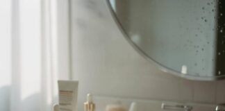 Anti-Aging Skincare: Top Products for Youthful, Glowing Skin in 2025 Anti-aging skincare products and a watch on a bathroom vanity.