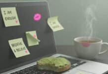 Self-Care Routines: The Best Ways to Nurture Your Mind and Body Half-eaten avocado toast on laptop with tea and affirmations.
